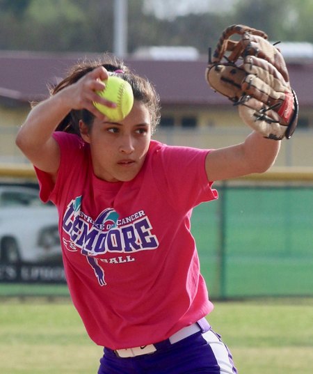 Lemoore High's Tomi Ford pitches to Redwood High School in the fourth inning of Friday's loss to the Rangers. It was the Tigers Cancer Awareness Game.